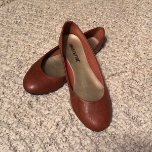 Brown leather flats
